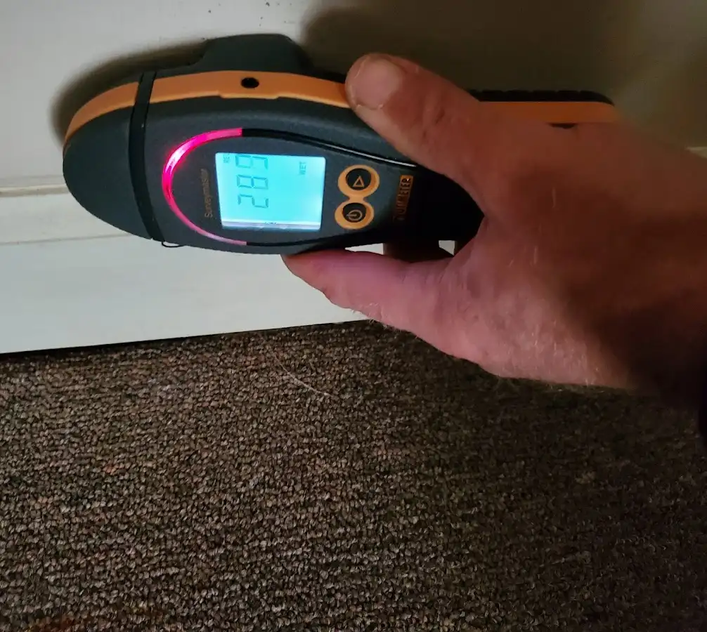 Moisture detection at baseboard during Storm Damage Restoration in Blythe